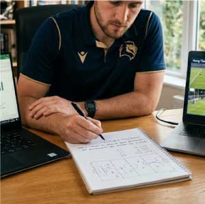 Football punter working on statistics